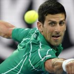 Djokovic downs Raonic to set up Federer semi-final